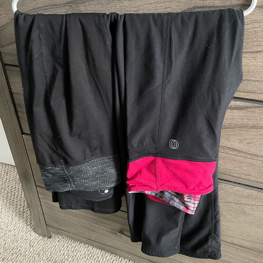 Black small flare exercise pants. Pink is reversible